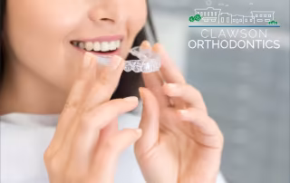 woman with clear aligners
